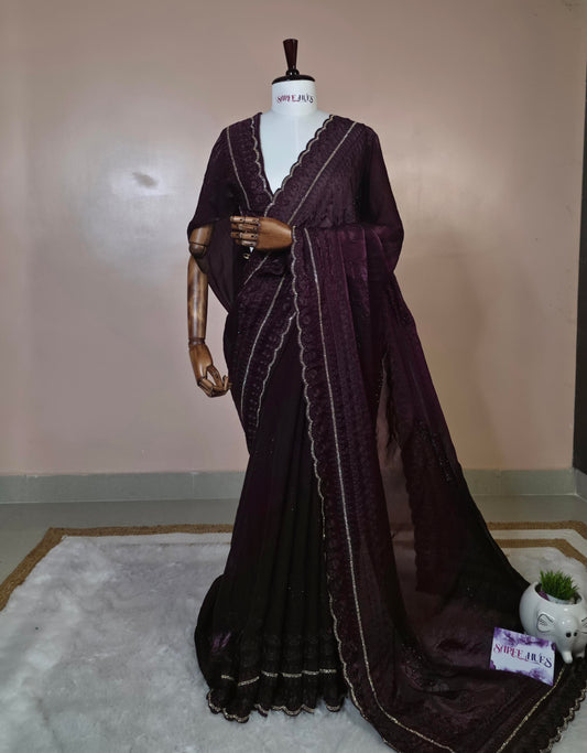 “Royal Plum Velvet-Glow Saree – Elegance Wrapped in Jewel Tones”