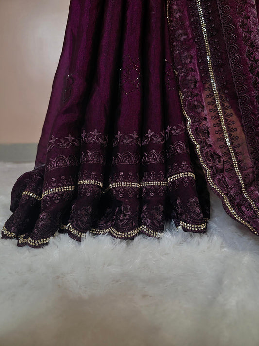 “Royal Plum Velvet-Glow Saree – Elegance Wrapped in Jewel Tones”