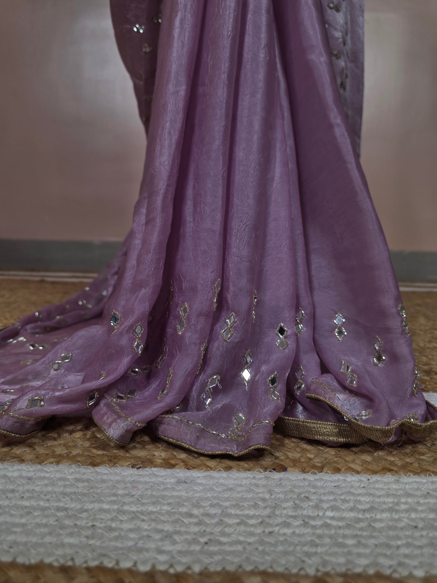 Close-up of a purple fabric with mirror embellishments