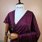 Deep wine satin silk saree with geometric Swarovski crystal work and bead embellishment on mannequin.