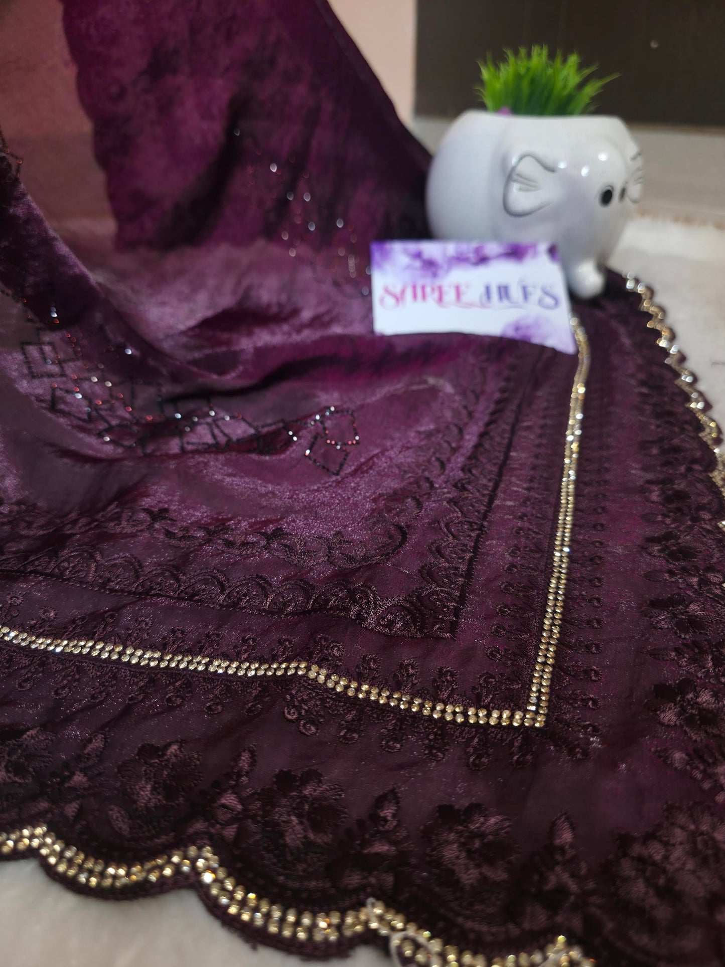 “Royal Plum Velvet-Glow Saree – Elegance Wrapped in Jewel Tones”