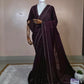 “Royal Plum Velvet-Glow Saree – Elegance Wrapped in Jewel Tones”